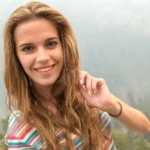 young beautiful woman traveling grand canyon usa seating edge rock 55375060